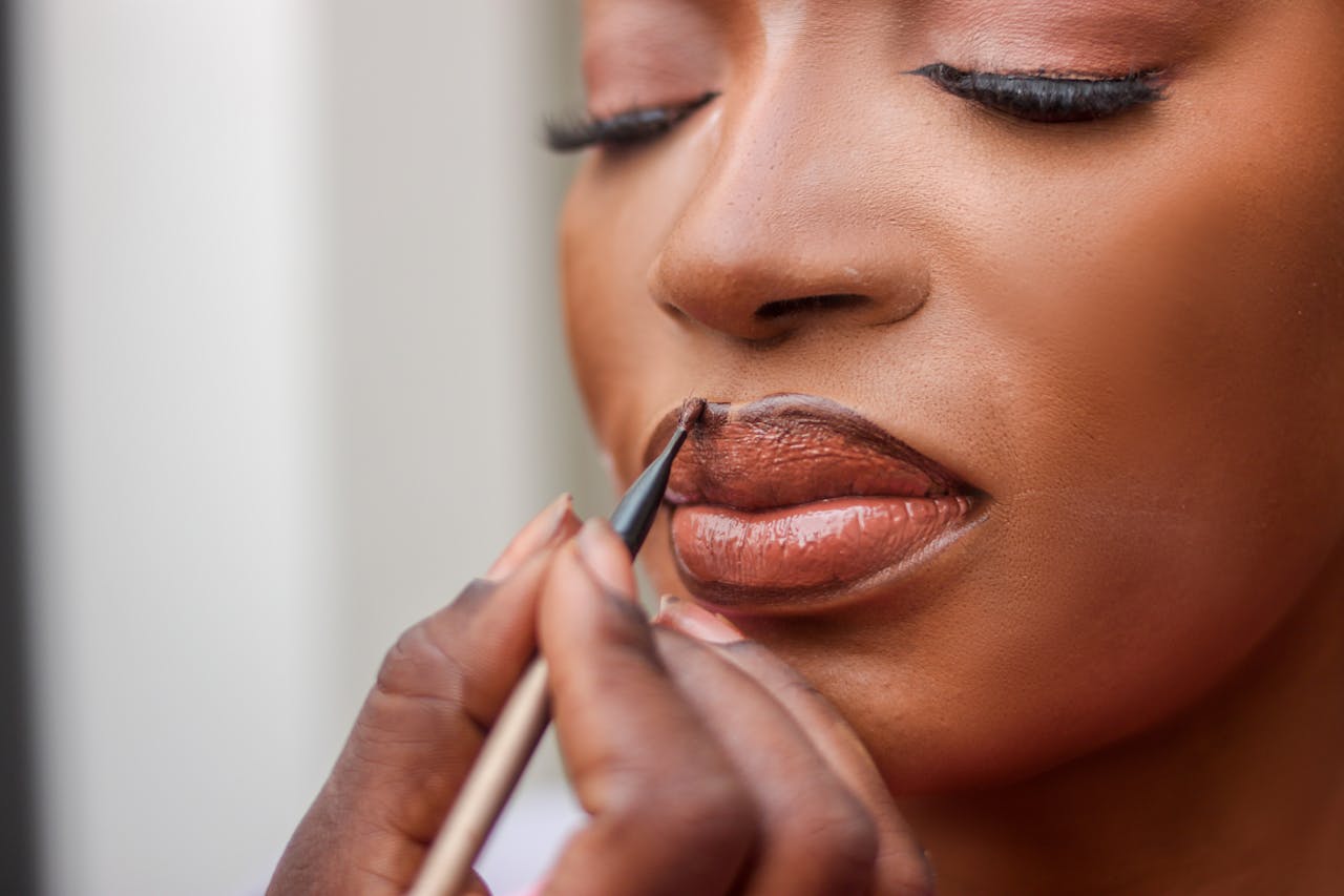 Close-up of bridal lip makeup application