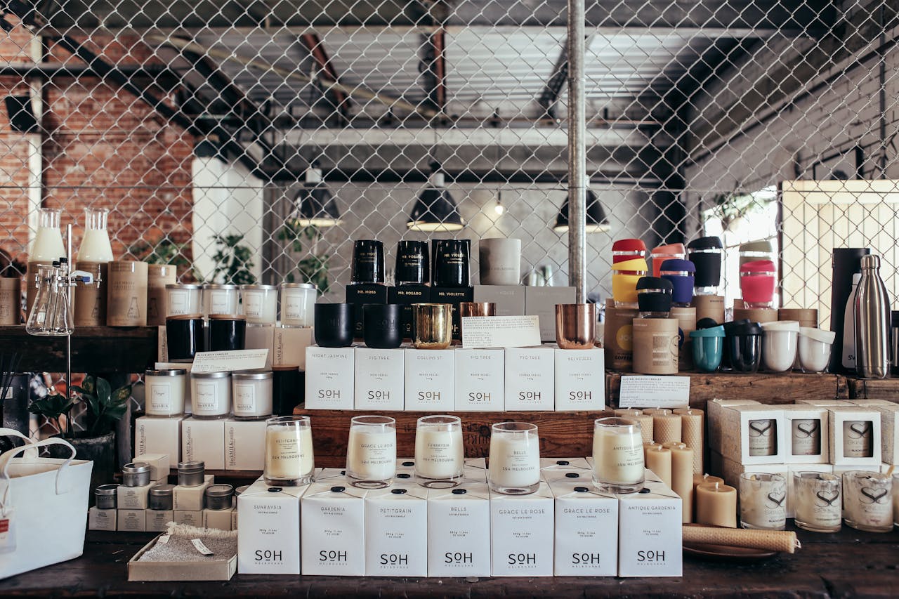 Friendly shop owner arranging products in a well-lit retail space