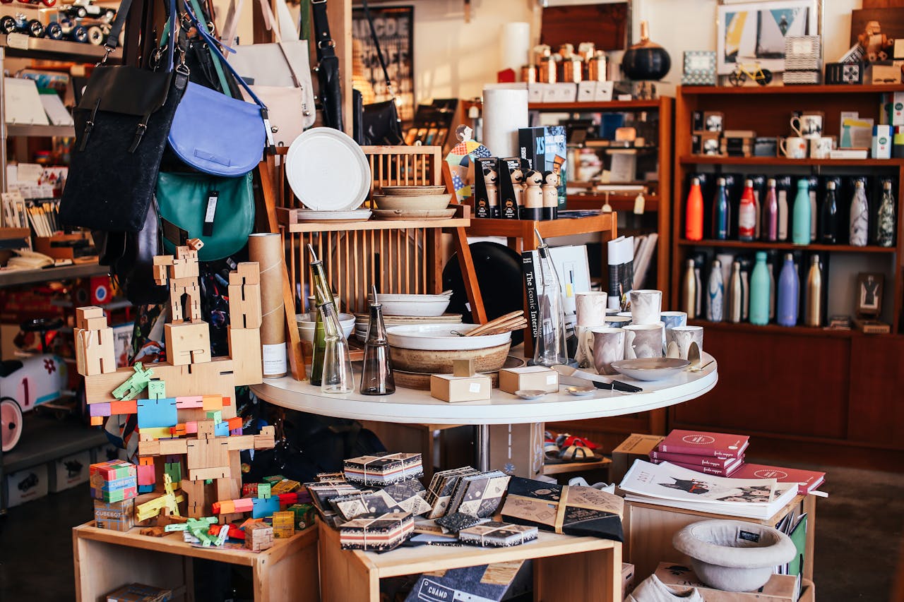 Friendly shop owner arranging products in a well-lit retail space